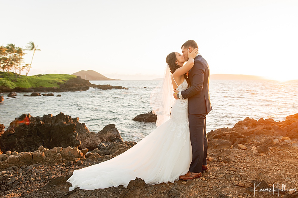 bride and groom by the ocean in Maui
