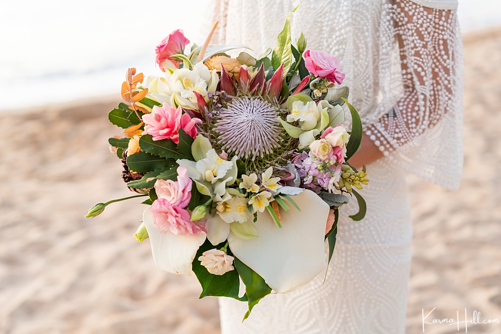 boho inspired beach wedding dress with beading and rustic bouquet
