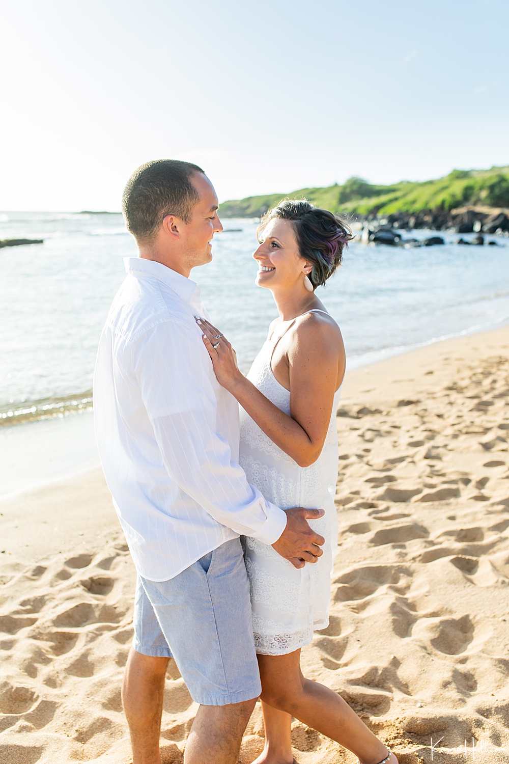 kauai couples photography man and woman embracing on a beach 