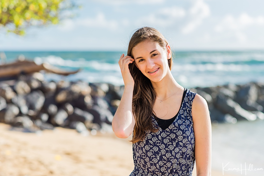 Beautiful young girl smiling on a Kauai beach 