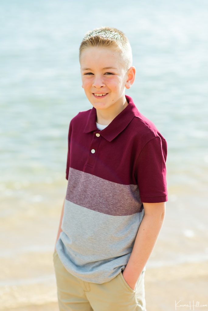 young boy smiling on Kauai beach 