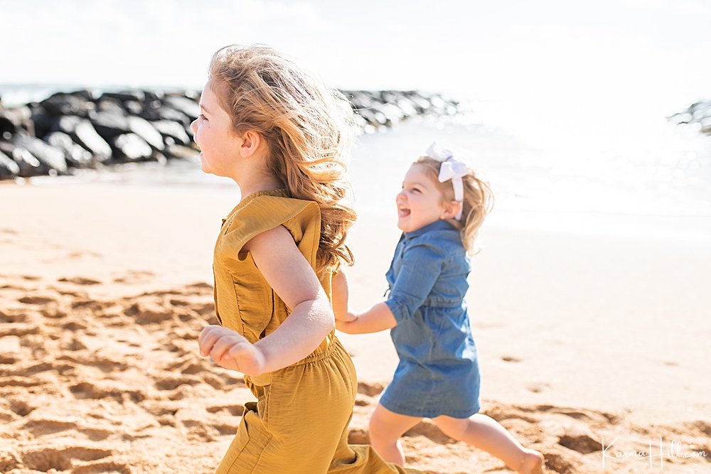 little girls running on the beach 