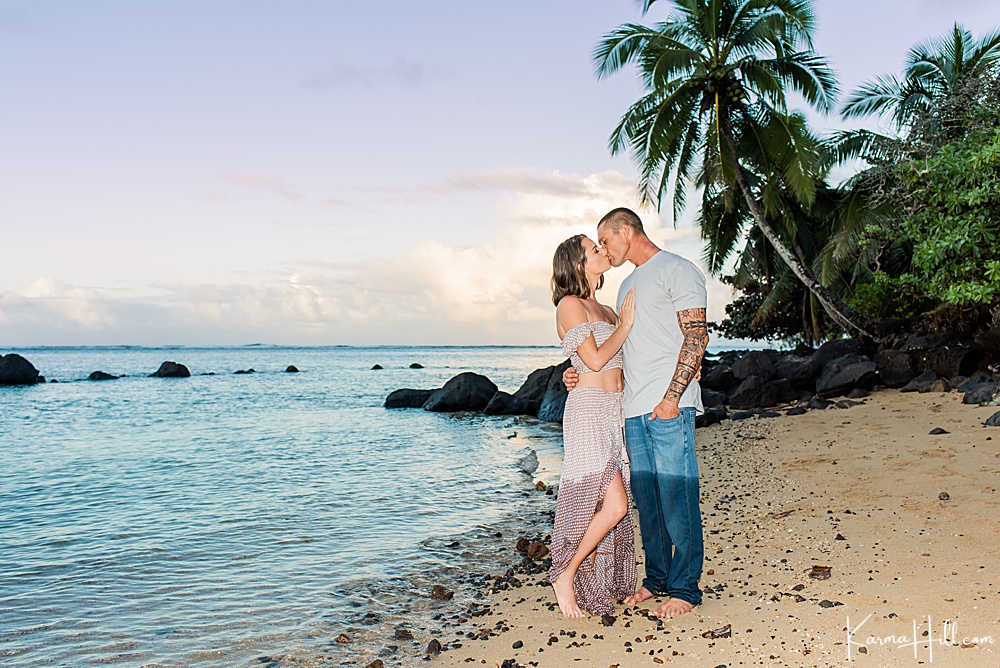 couple kissing on kauai beach 