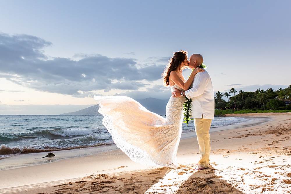 best wedding photographer on Maui - bride and groom kissing on maui beach - elope on maui 