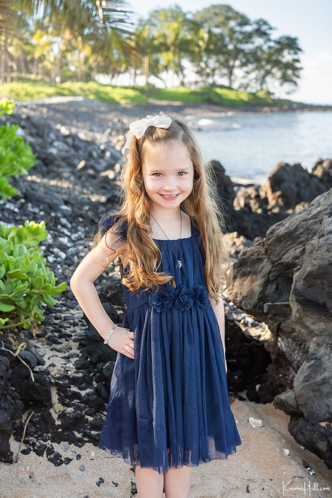 top maui photographer - young girl in a navy dress by the shoreline 