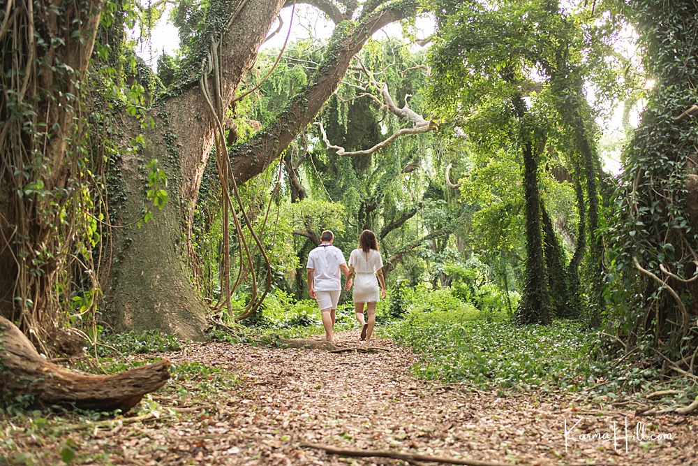 couple walking down a jungle path