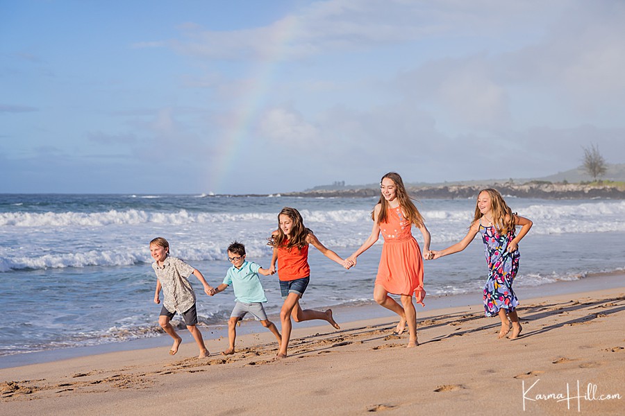 Hawaii vacation during COVID-19 - children running under a rainbow