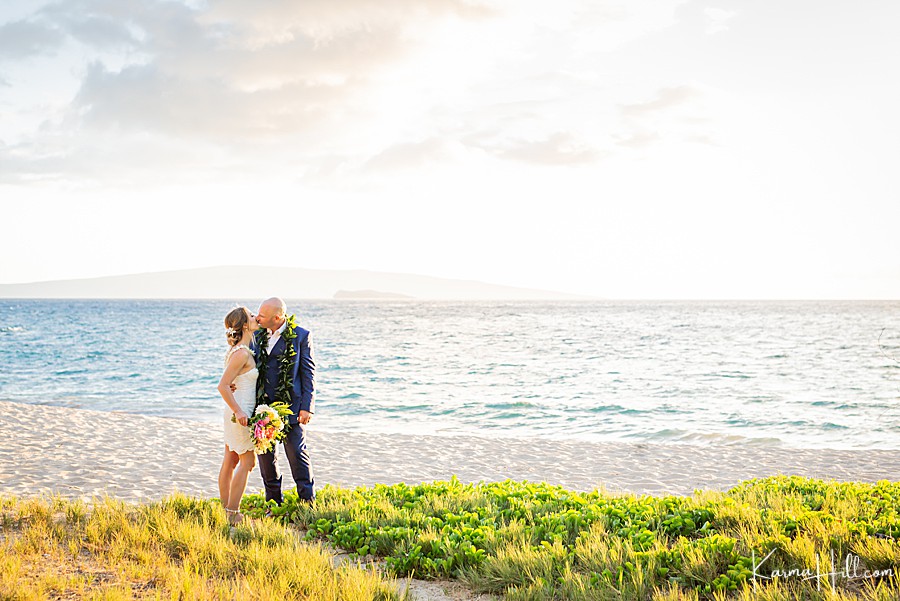 Hawaii bride and groom kissing on the beach