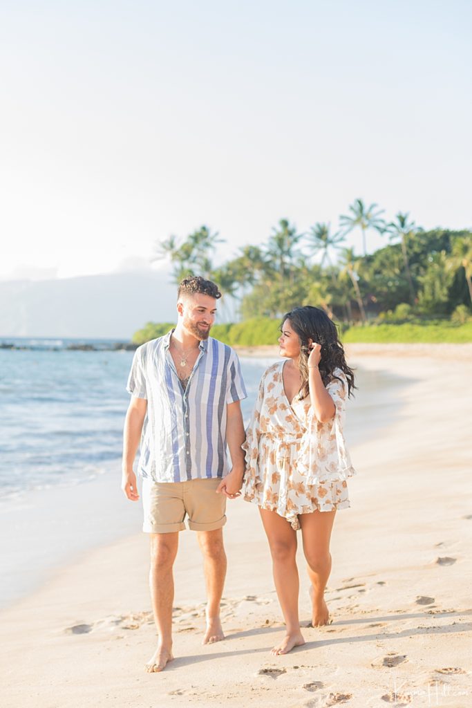 couple walking on hawaii beach 