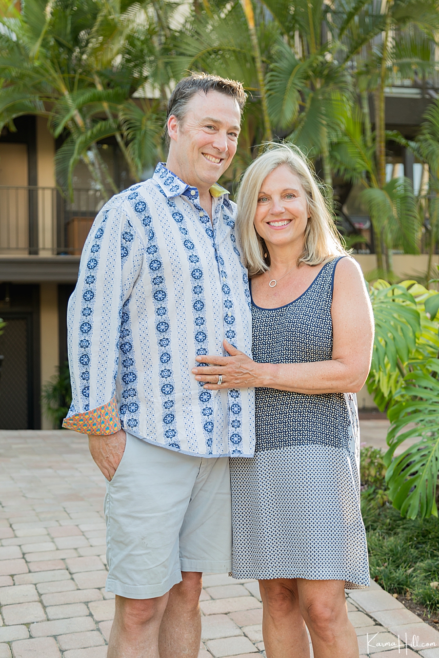 husband and wife pose for professional photography on maui 