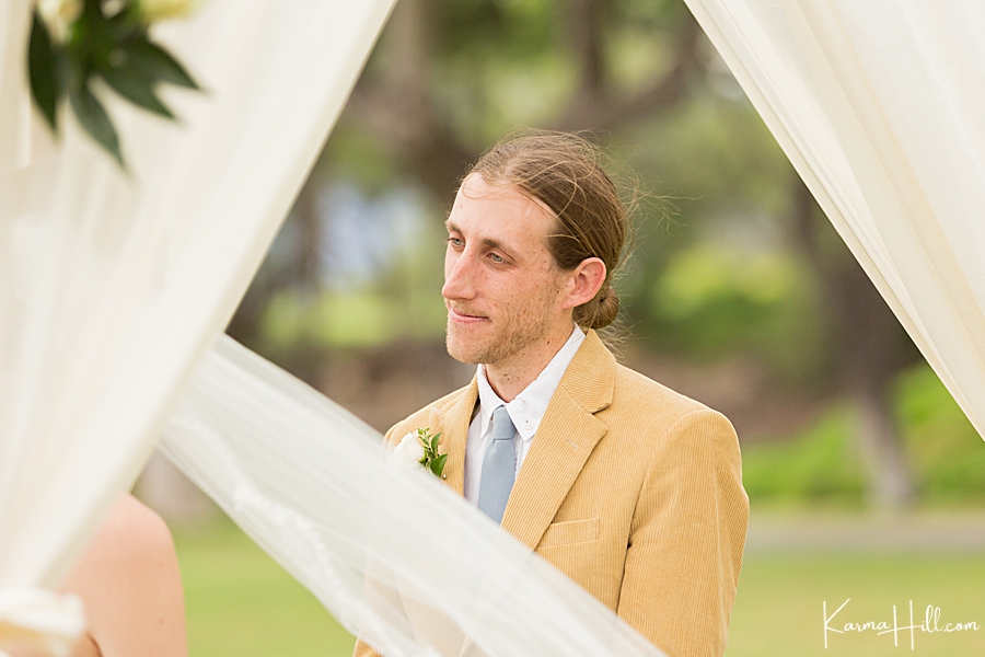groom's face as bride share's her vows