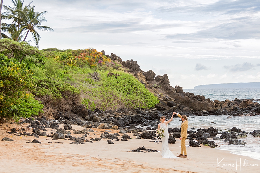just married couple dance on a maui beach 