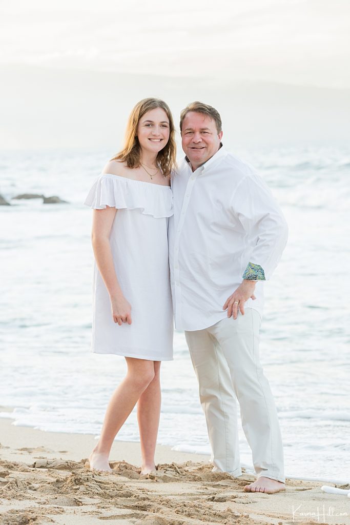 father and daughter pose for family photos in hawaii 