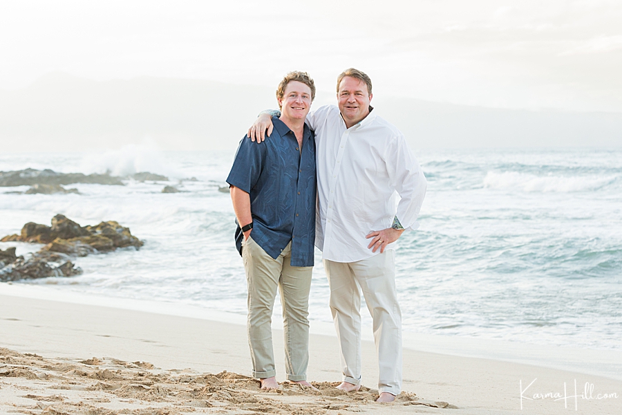 father and son pose for family photos in hawaii 