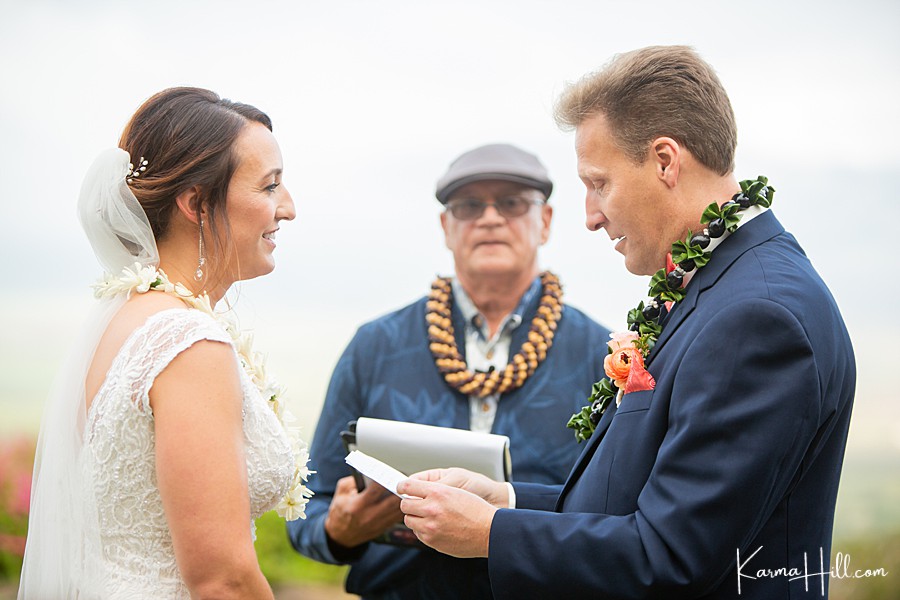 bride and groom exchange vows at their real wedding in hawaii 