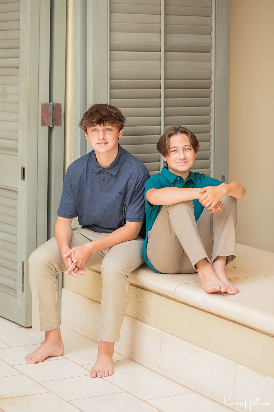 two brothers sit for family photography at the four seasons in maui 