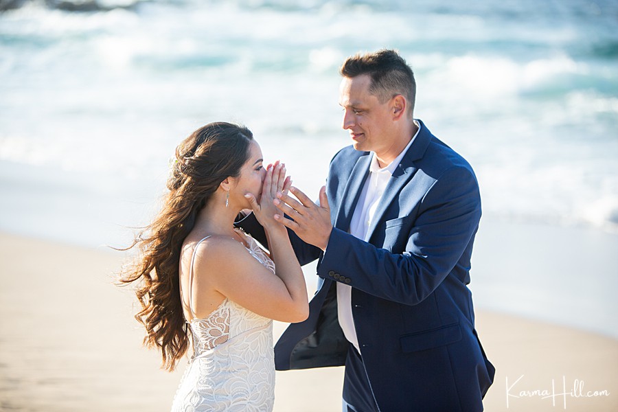 bride wipes tears from her eyes during her hawaii beach wedding 
