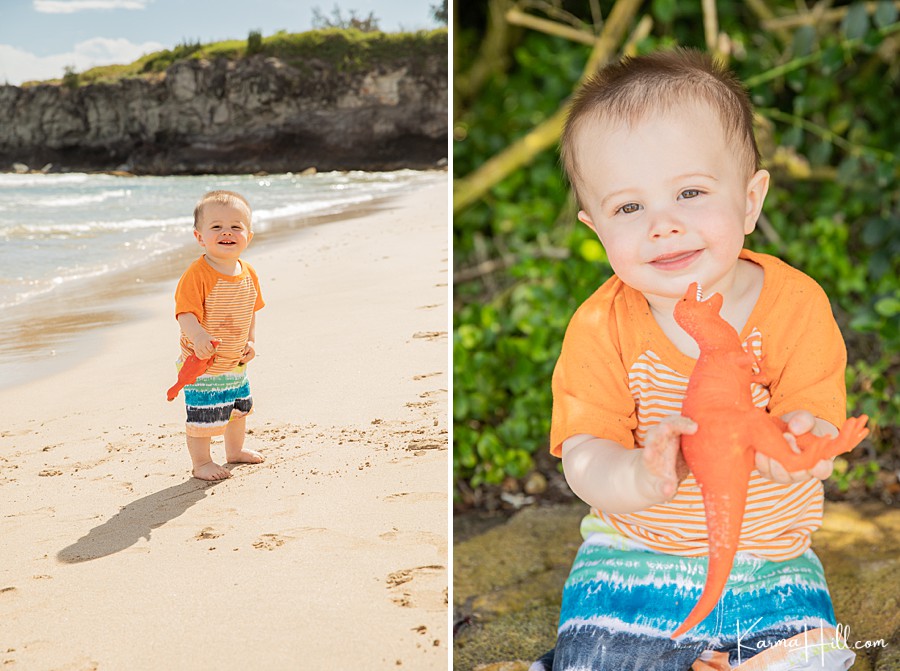 cute toddler boy holds orange dinosaur on maui beach 