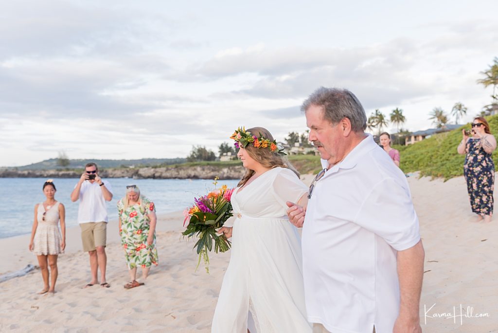 real maui wedding image of reverend waiting with two men and a maid of honor on the beach 