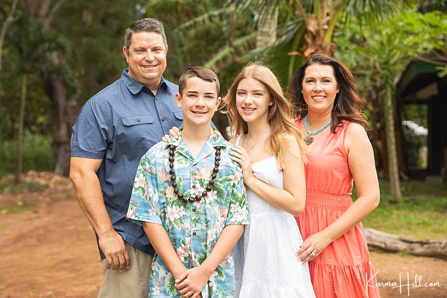 cute family portraits in hawaii with palm trees 