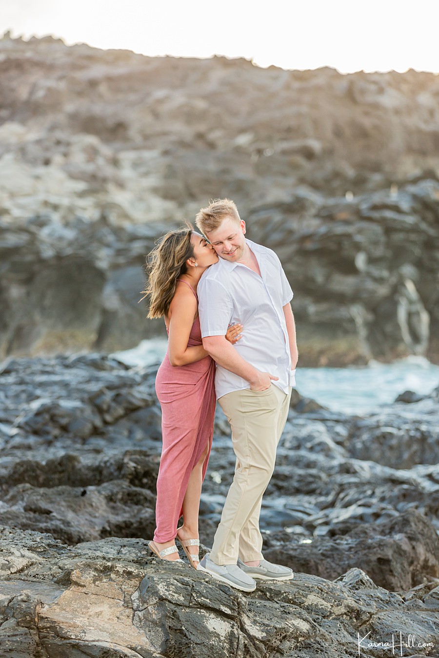 couple posing on rocks