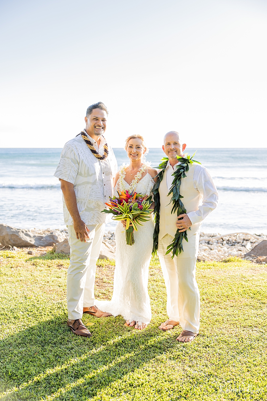bride and groom with maui officiant
