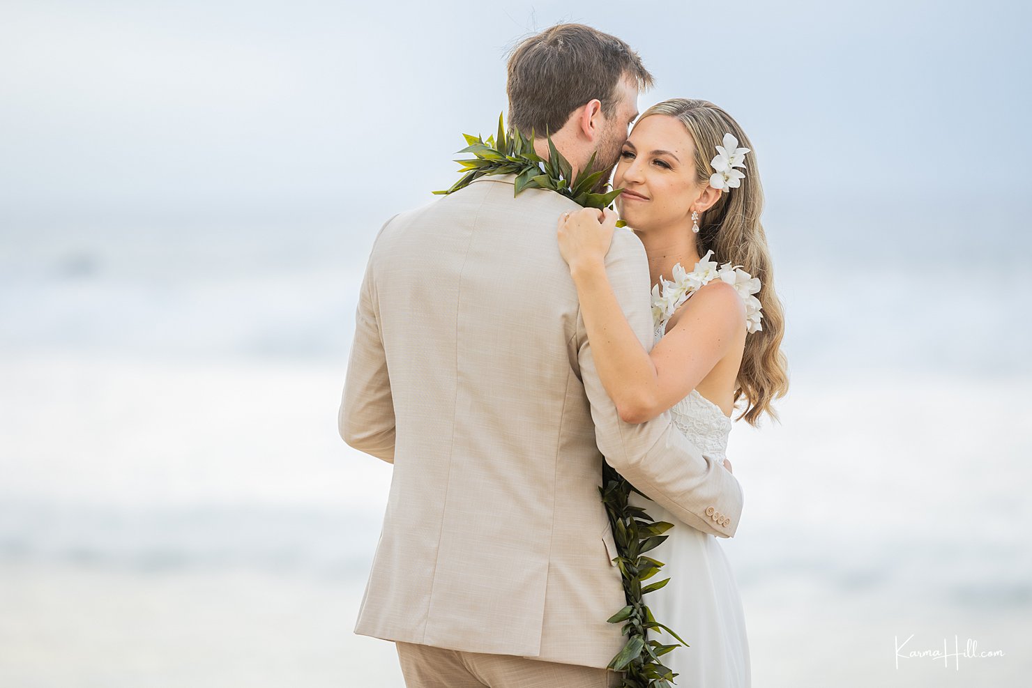 bride and groom first dance on beach