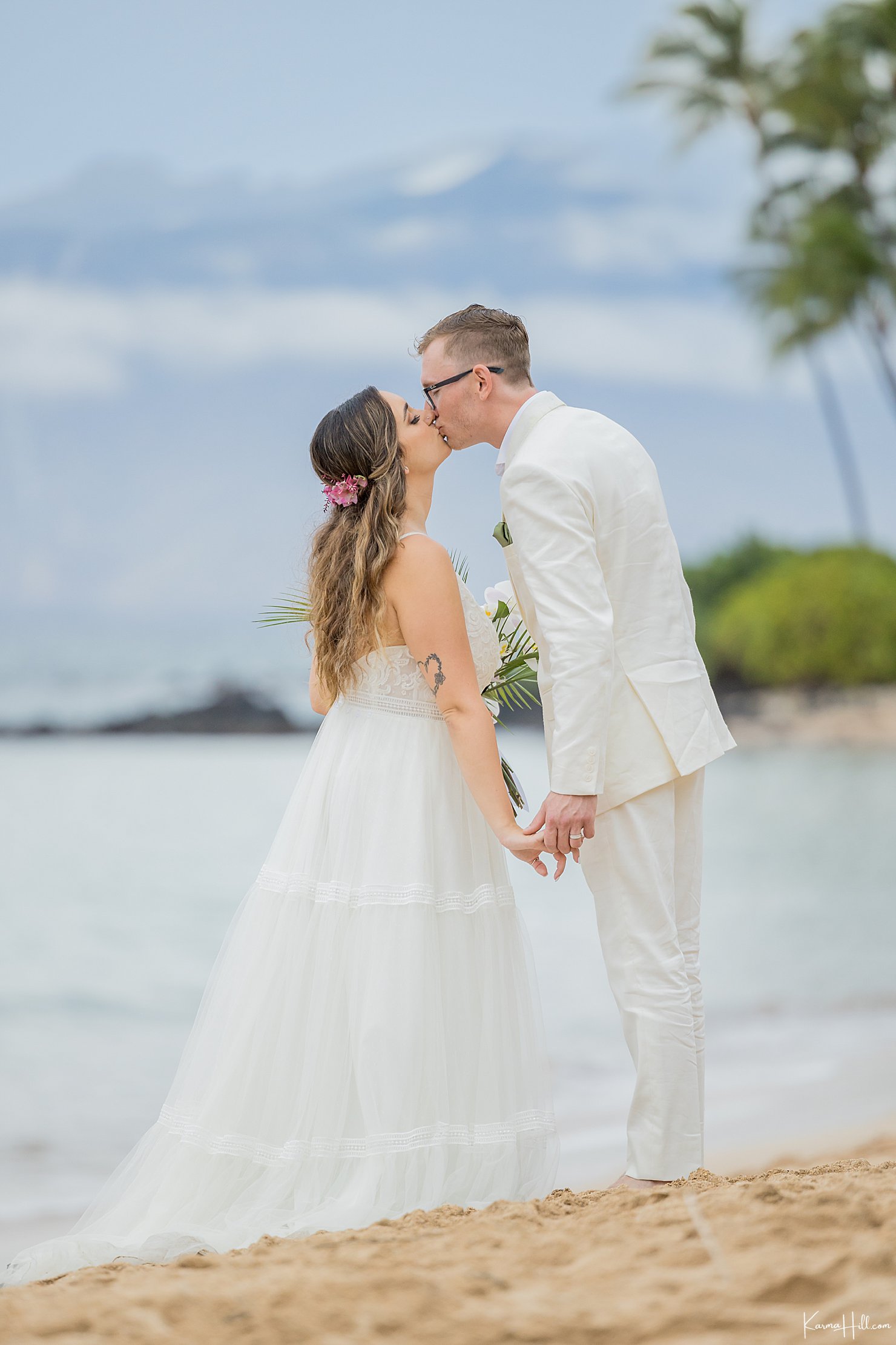 newlyweds in maui on beach