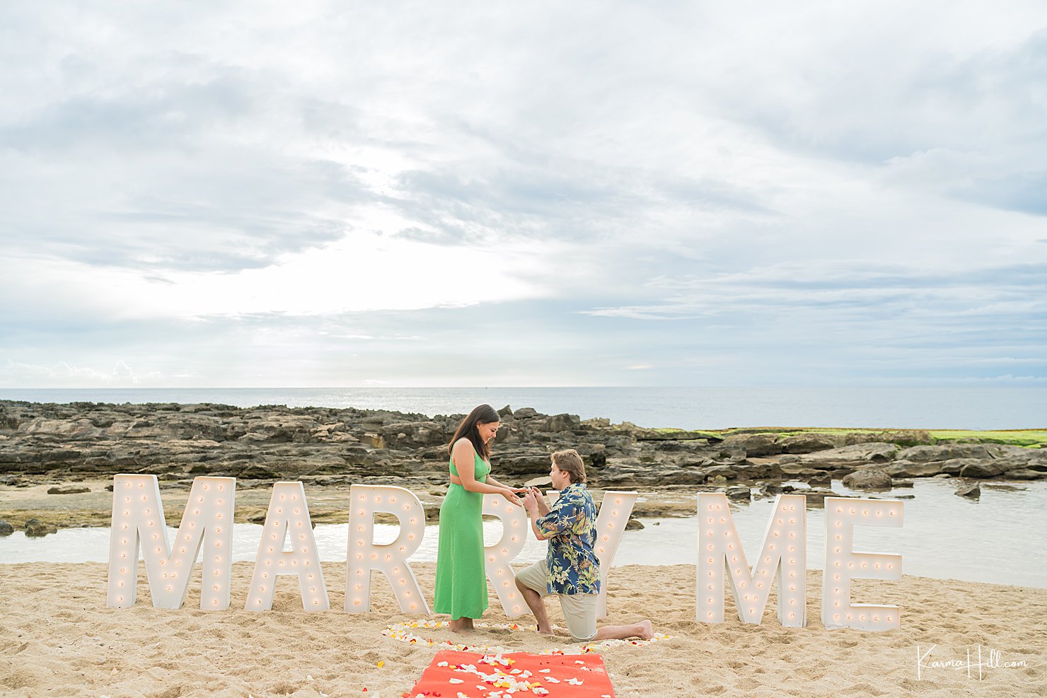 man proposing on beach