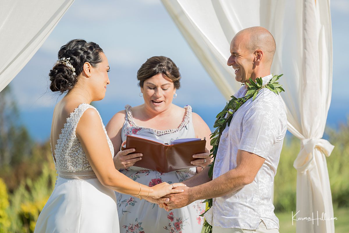wedding photo in Maui of bride and groom holding hands