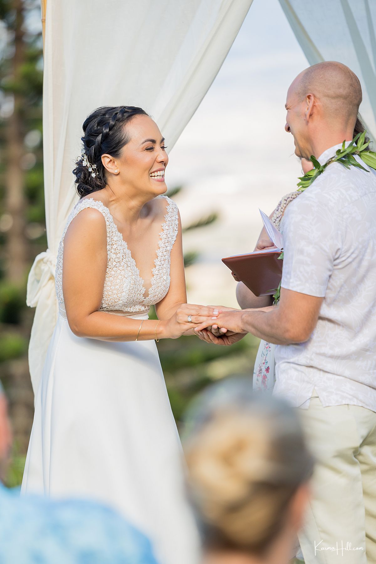wedding photographer in Maui during ring exchange
