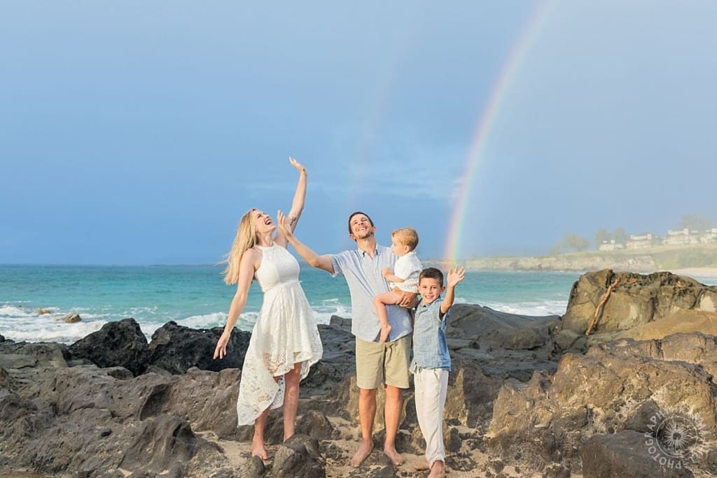 Maui family portraits in the rain with rainbow