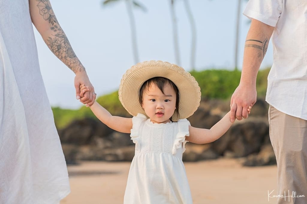 little girl wearing hat during Maui photoshoot