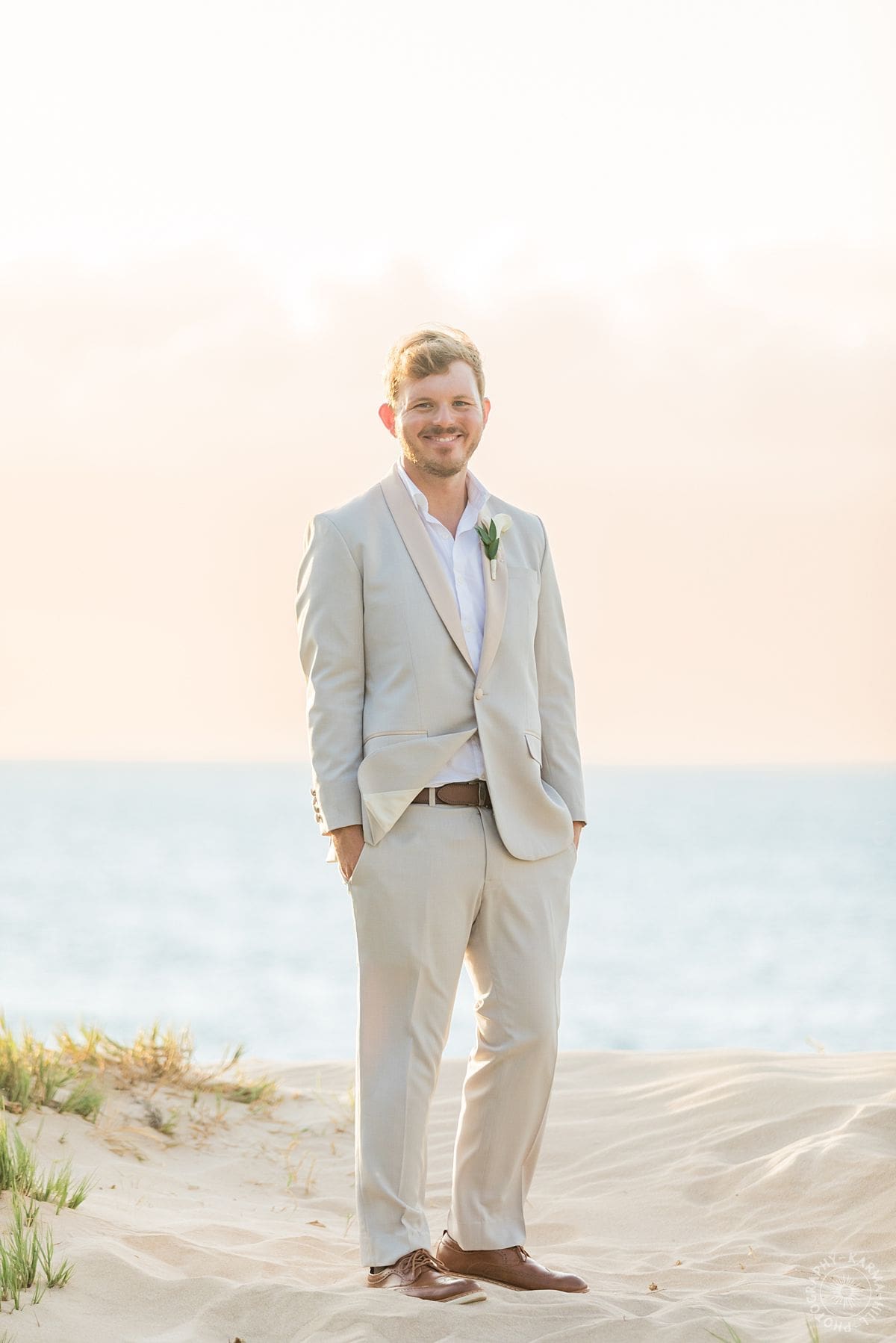 groom on beach 